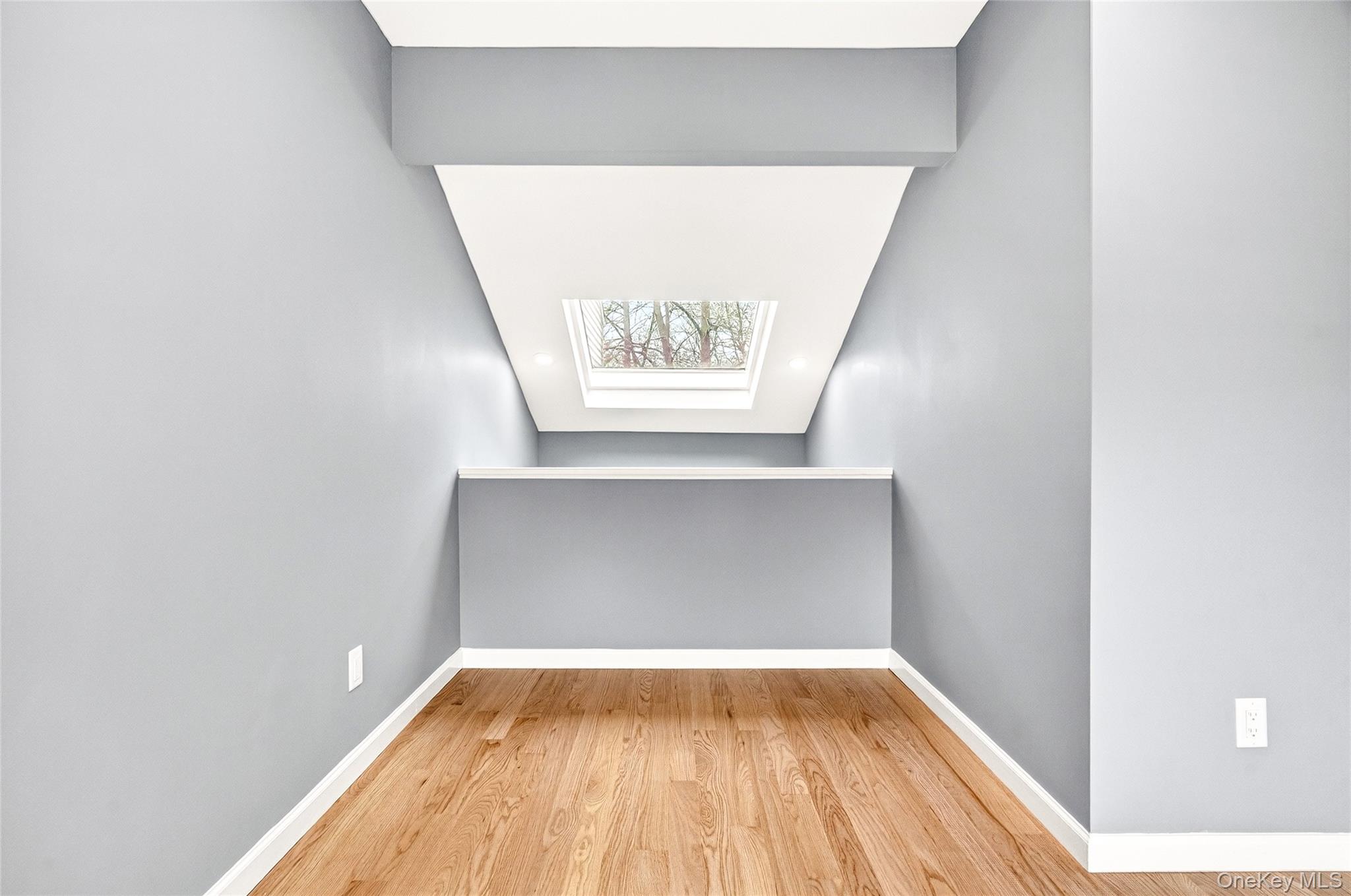 14 Bridle Path Road Ossining, NY 10562 - Photo 32 of 45 a view of a hallway with wooden floor and a window