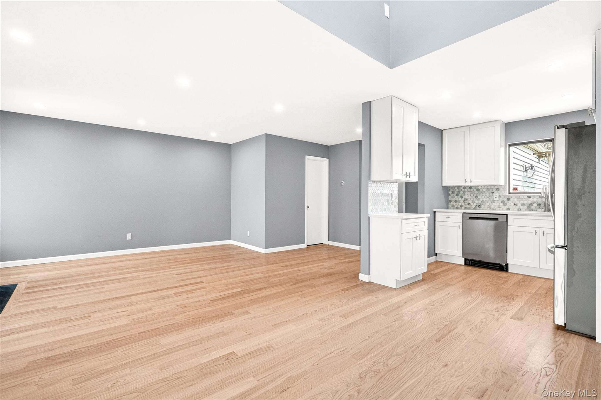 14 Bridle Path Road Ossining, NY 10562 - Photo 6 of 45 a kitchen with white cabinets and white appliances