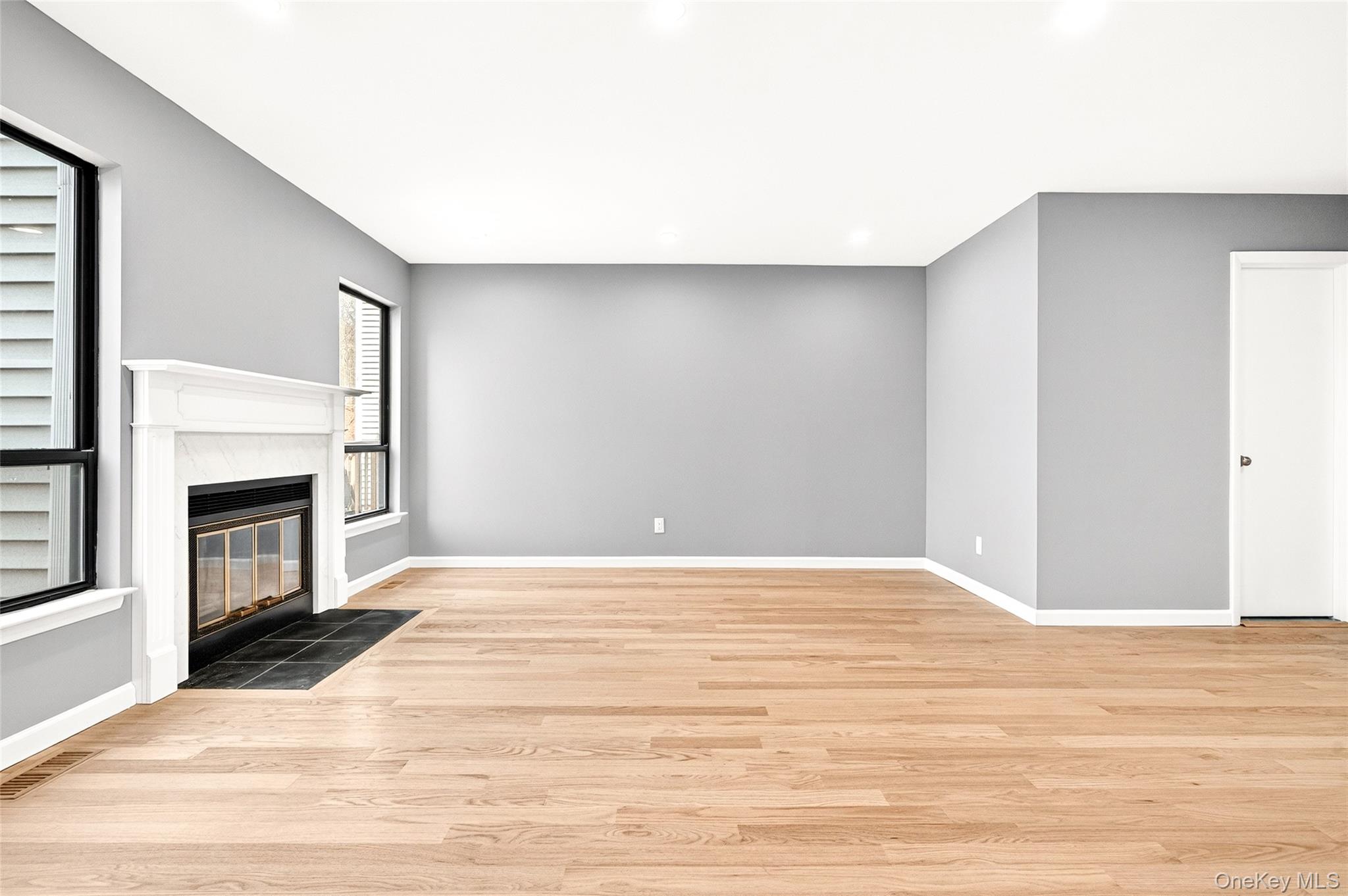 14 Bridle Path Road Ossining, NY 10562 - Photo 7 of 45 a view of empty room with wooden floor and fireplace