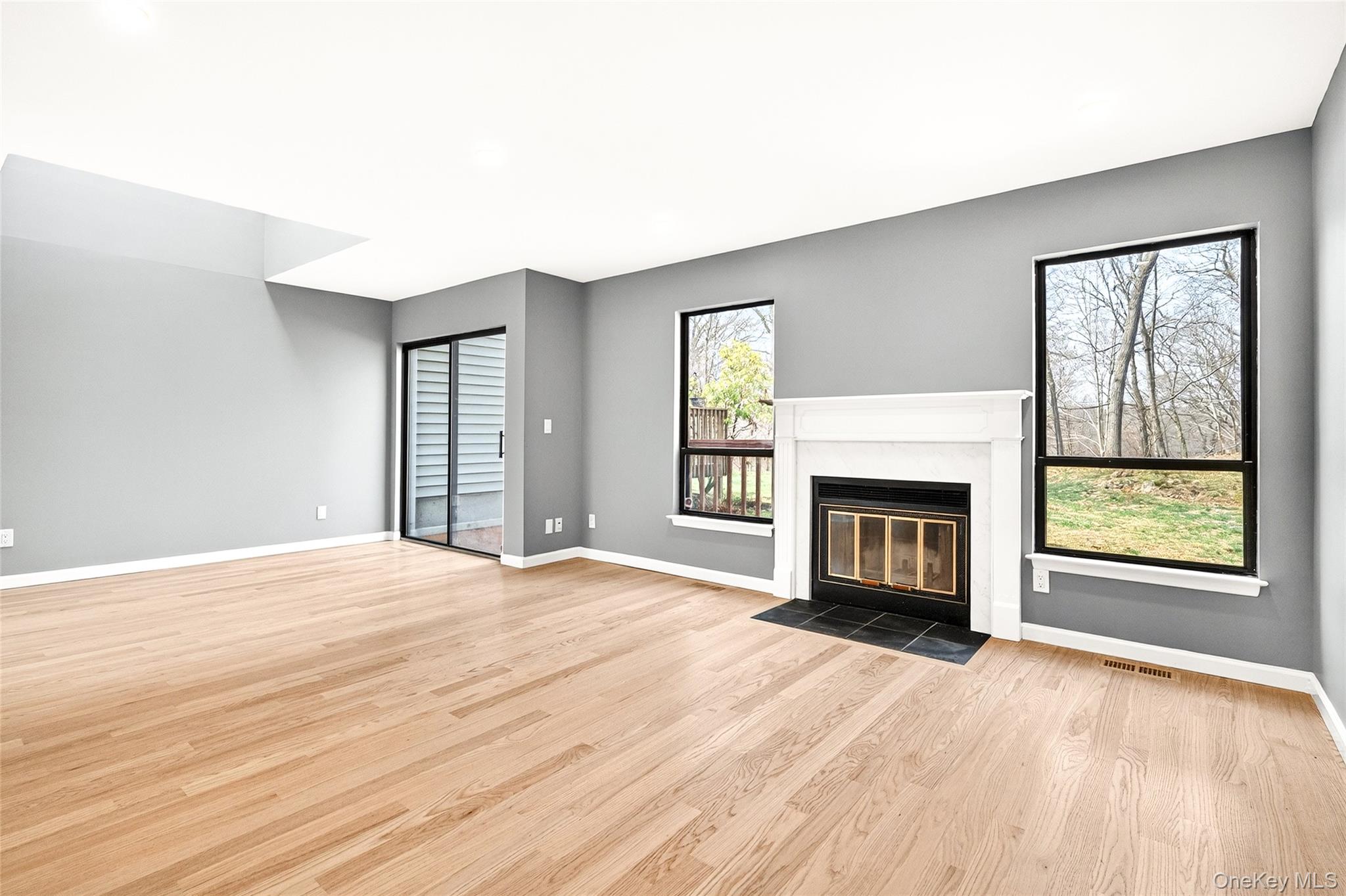 14 Bridle Path Road Ossining, NY 10562 - Photo 10 of 45 a view of an empty room with a window and fireplace