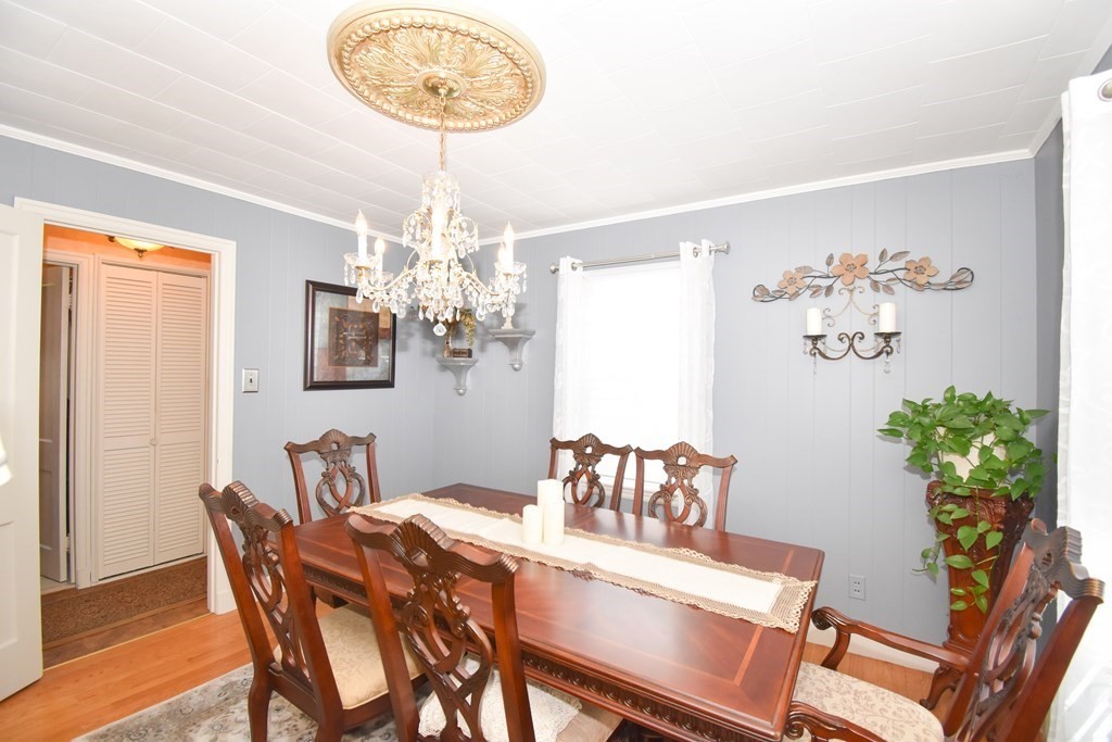 276 Oak Street Springfield, MA 01151 - Photo 13 of 36 a view of a dining room with furniture and chandelier