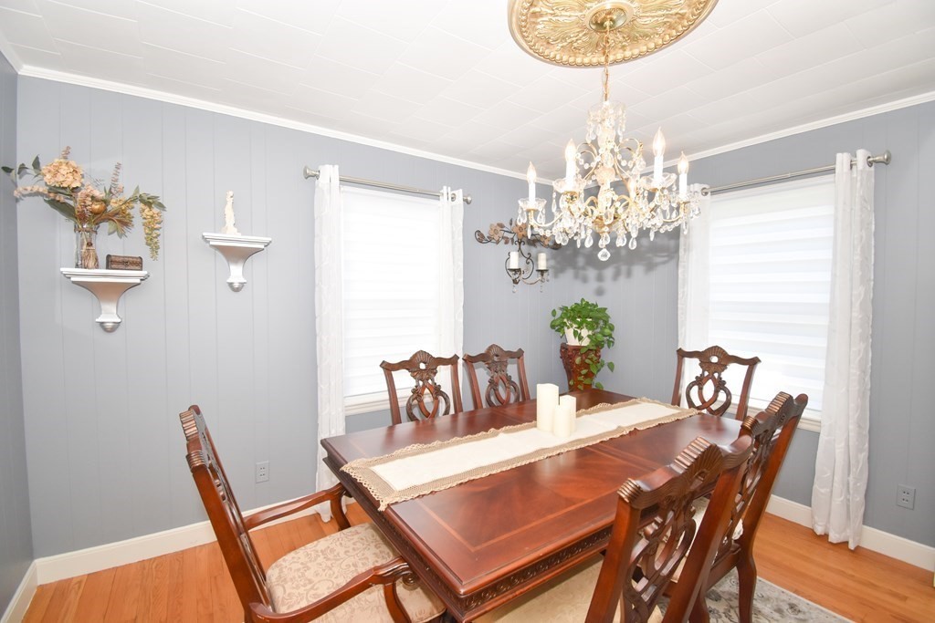 276 Oak Street Springfield, MA 01151 - Photo 14 of 36 a dining room with furniture and chandelier