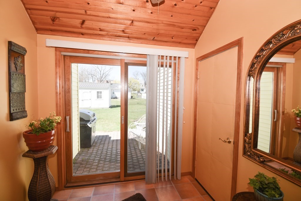 276 Oak Street Springfield, MA 01151 - Photo 17 of 36 a view of front door with wooden floor