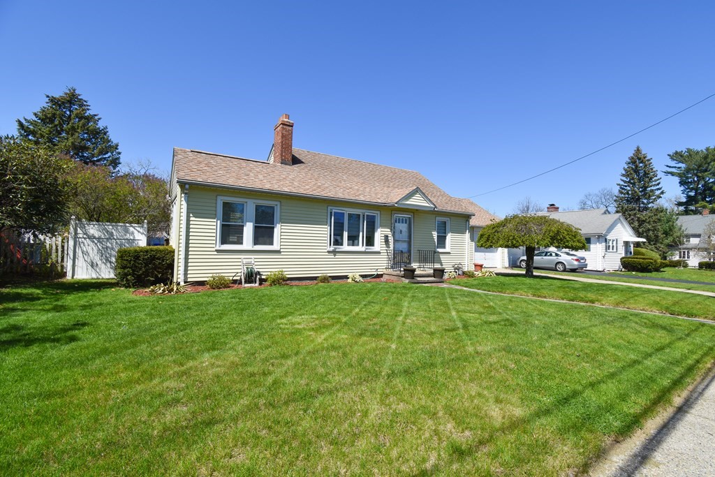 276 Oak Street Springfield, MA 01151 - Photo 2 of 36 a front view of a house with a yard