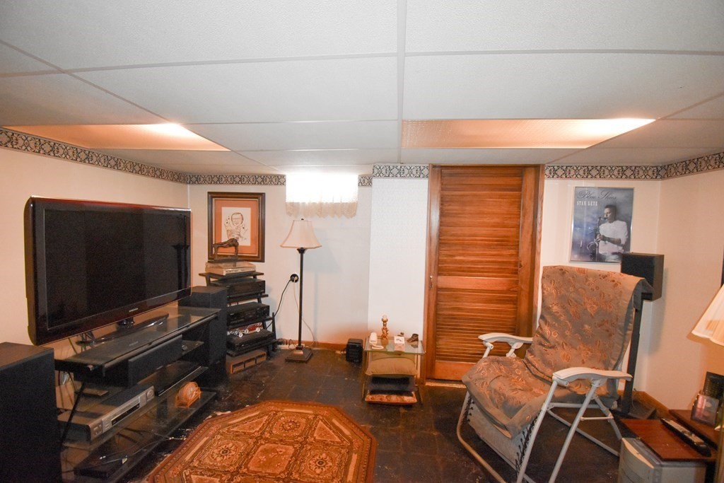 276 Oak Street Springfield, MA 01151 - Photo 23 of 36 a living room with furniture and a flat screen tv