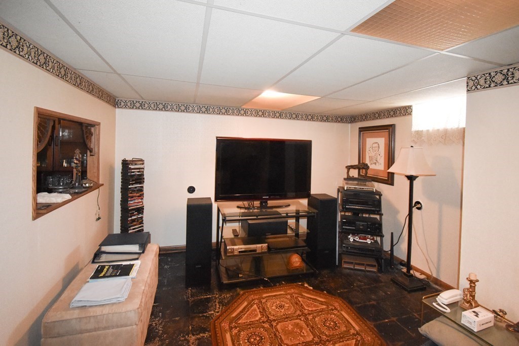 276 Oak Street Springfield, MA 01151 - Photo 25 of 36 a room with furniture and flat screen tv