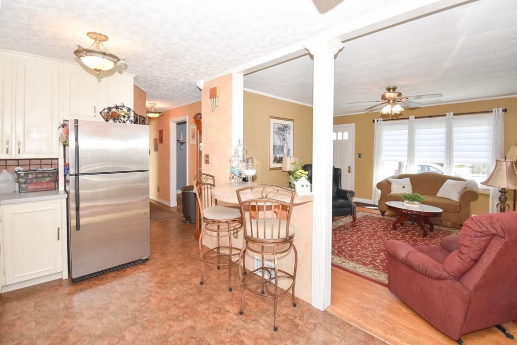 276 Oak Street Springfield, MA 01151 - Photo 8 of 36 a living room with furniture a large window with stainless steel appliances