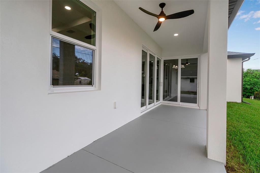 776 Cypress Road Venice, FL 34293 - Photo 12 of 89 an empty room with ceiling fan and window