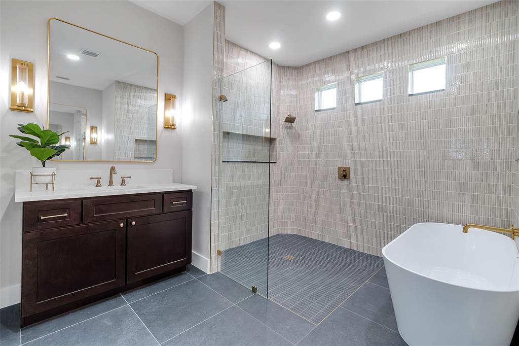776 Cypress Road Venice, FL 34293 - Photo 16 of 89 a spacious bathroom with a bathtub shower sink mirror and toilet