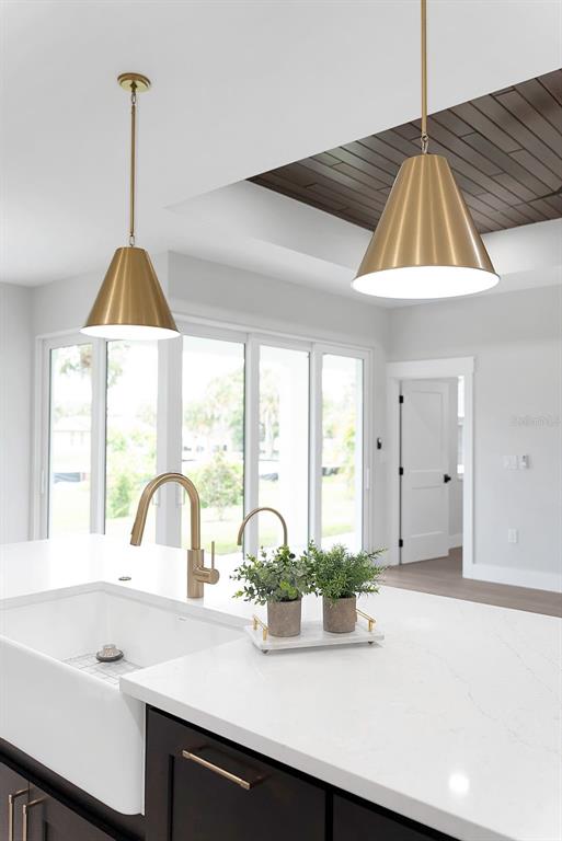 776 Cypress Road Venice, FL 34293 - Photo 34 of 89 a kitchen with a sink cabinets and a large window