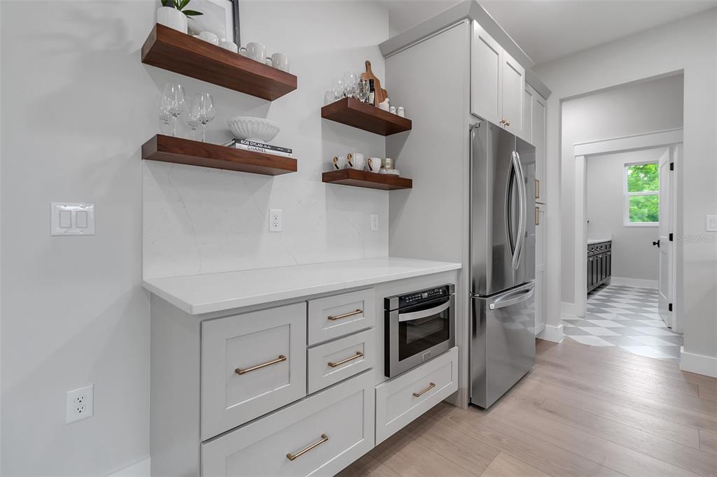 776 Cypress Road Venice, FL 34293 - Photo 41 of 89 a kitchen with stainless steel appliances a stove and a refrigerator