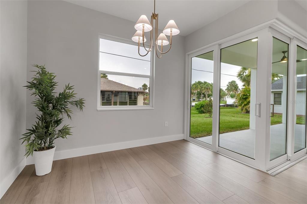 776 Cypress Road Venice, FL 34293 - Photo 46 of 89 a view of an room with wooden floor and balcony