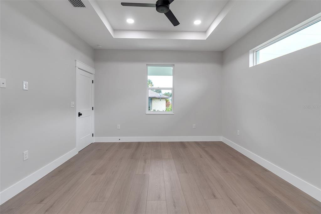 776 Cypress Road Venice, FL 34293 - Photo 61 of 89 wooden floor in an empty room with a window