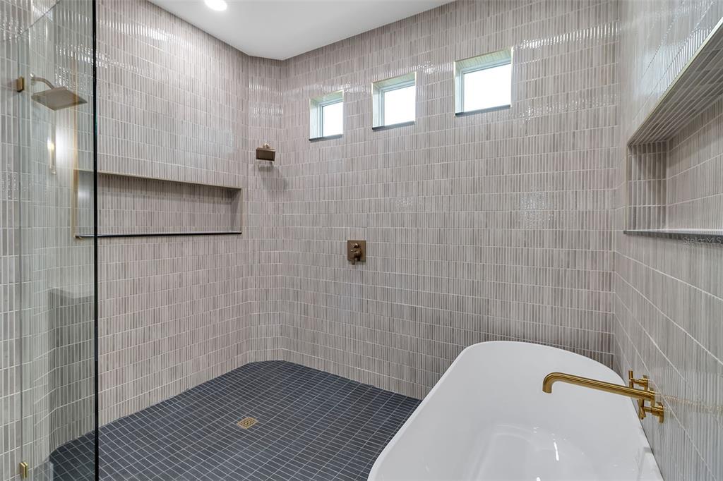 776 Cypress Road Venice, FL 34293 - Photo 62 of 89 a bathroom with a bathtub and shower