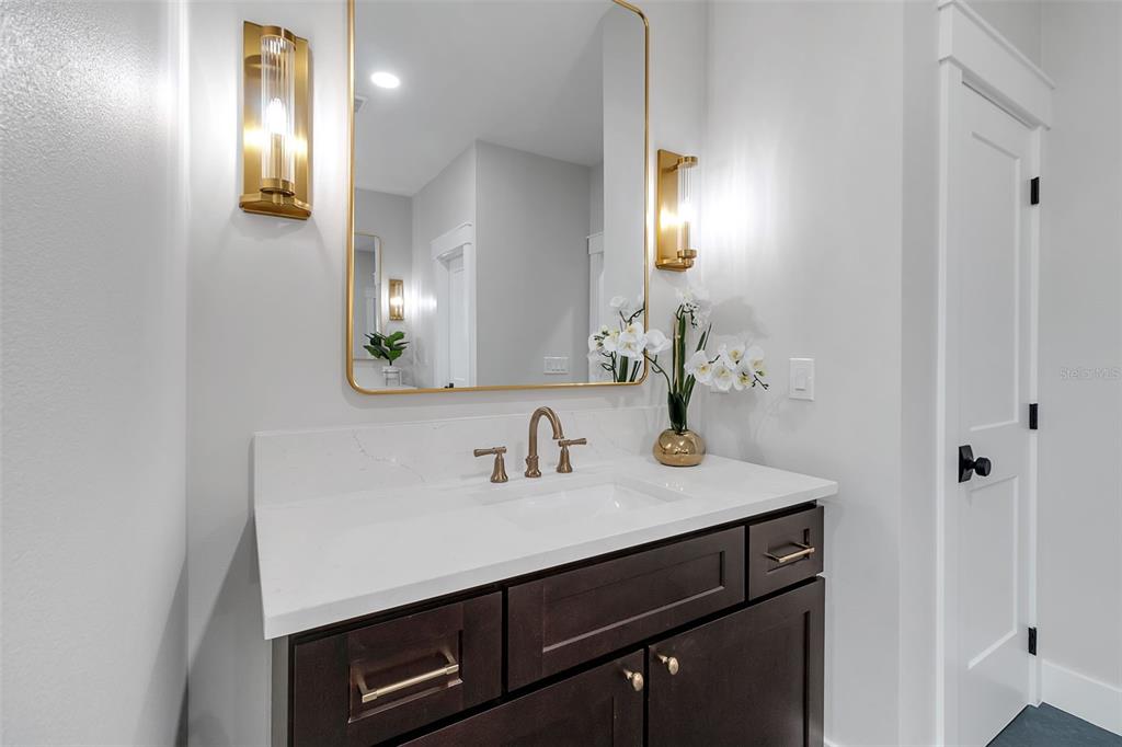 776 Cypress Road Venice, FL 34293 - Photo 70 of 89 a bathroom with a sink and a mirror