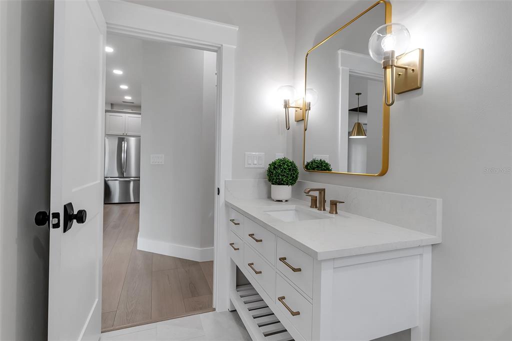 776 Cypress Road Venice, FL 34293 - Photo 81 of 89 a bathroom with a sink vanity and a mirror