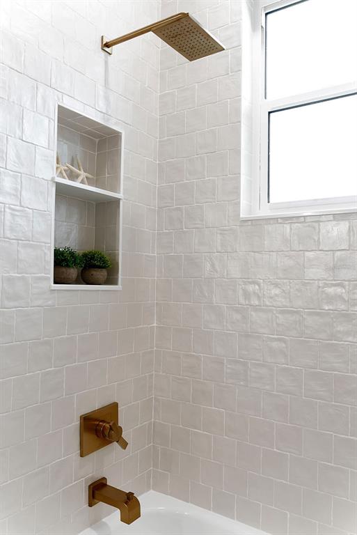 776 Cypress Road Venice, FL 34293 - Photo 86 of 89 a bathroom with a shower and a window