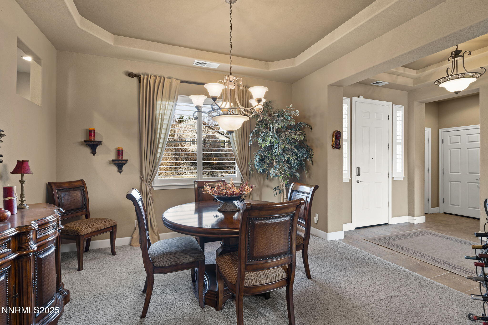 2757 Robb Drive Reno, NV 89523 - Photo 13 of 51 a dining room with furniture a chandelier and window