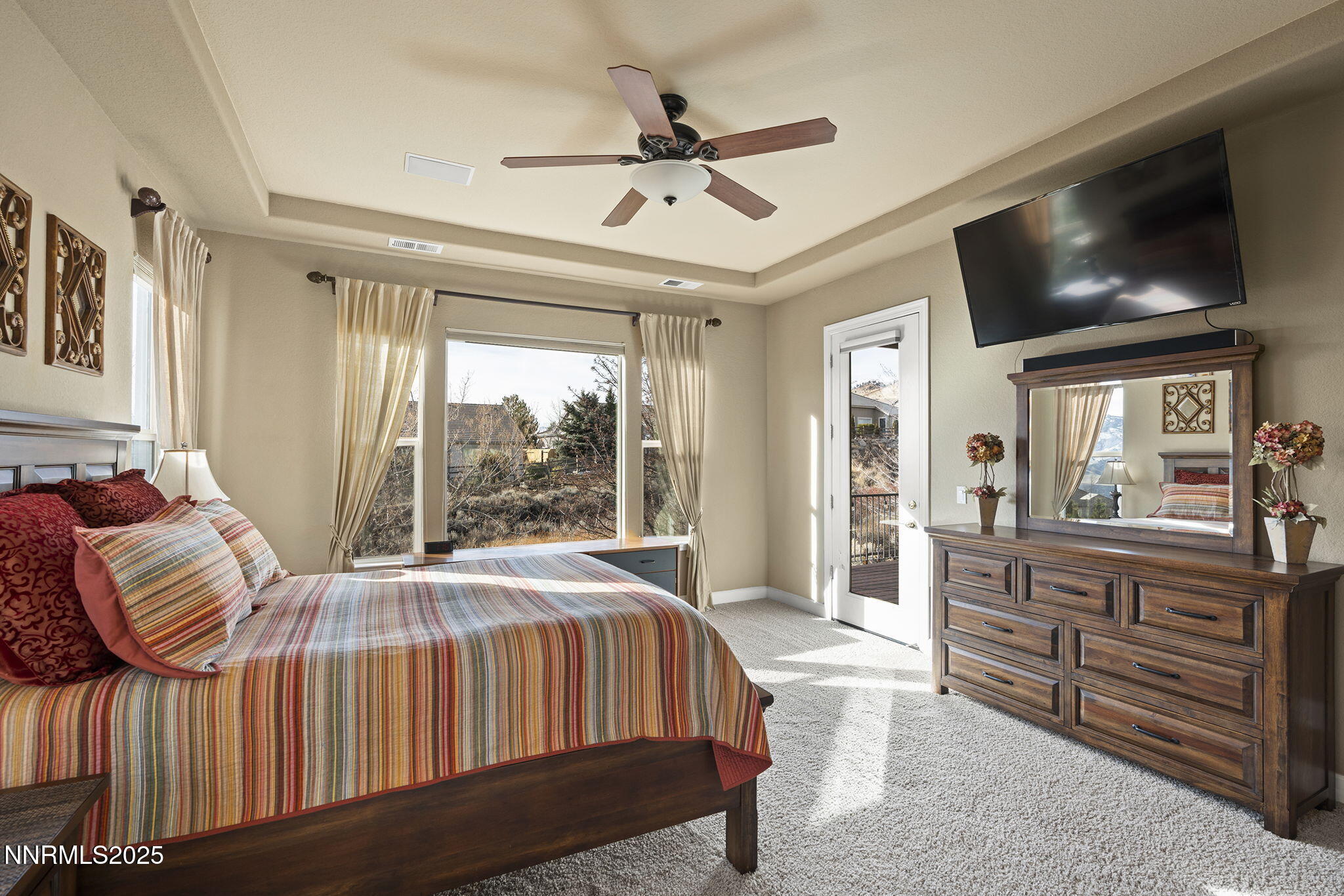 2757 Robb Drive Reno, NV 89523 - Photo 16 of 51 a living room with a bed furniture flat screen tv and a large window