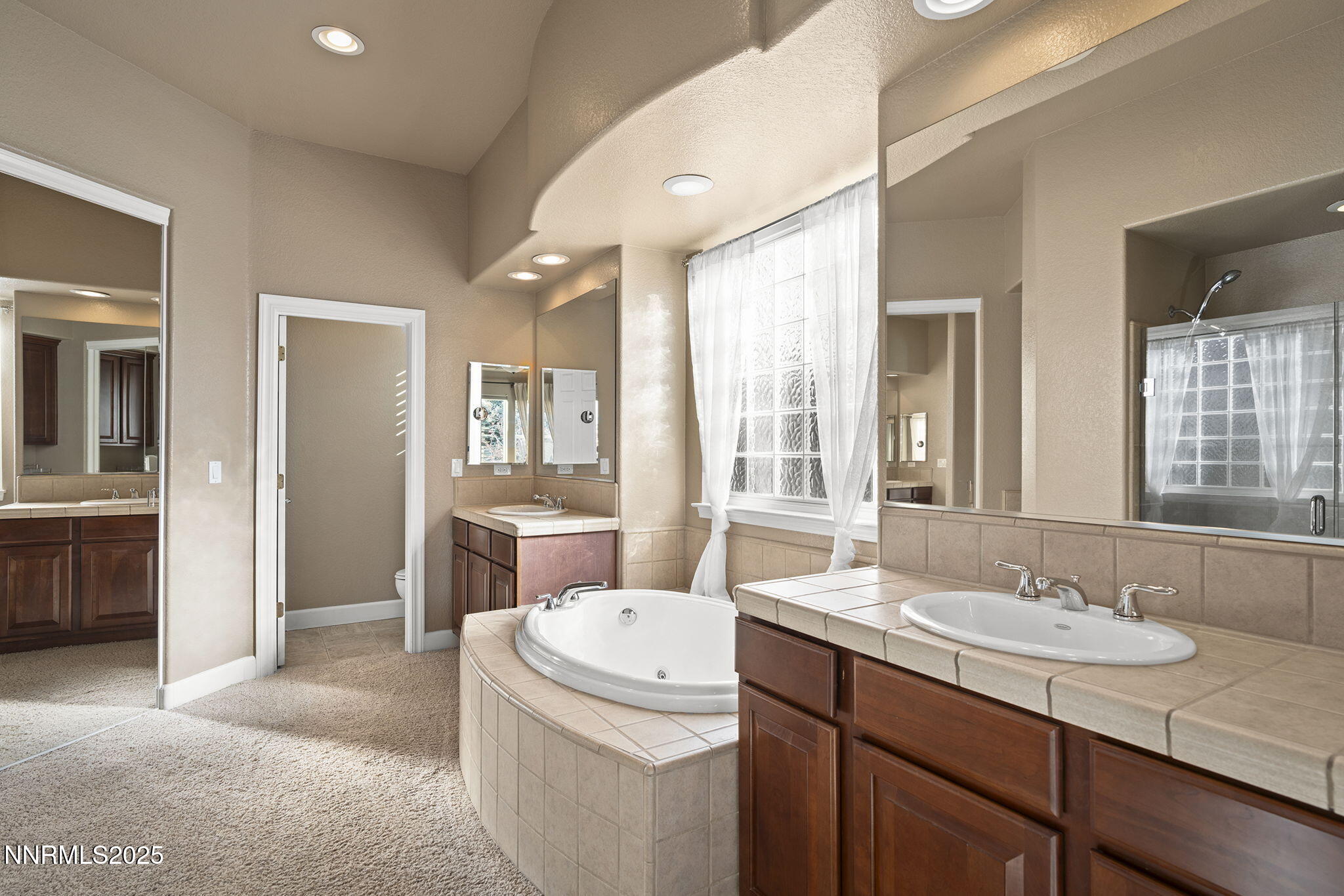 2757 Robb Drive Reno, NV 89523 - Photo 18 of 51 a bathroom with a granite countertop sink and a mirror