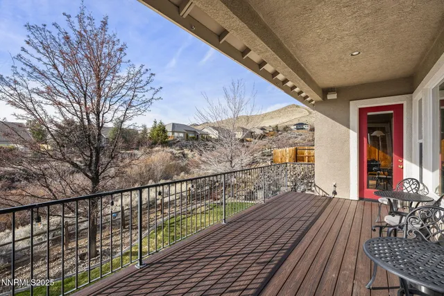 a view of a balcony with wooden floor