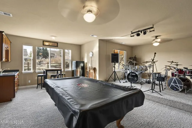a view of a livingroom with furniture and a chandelier