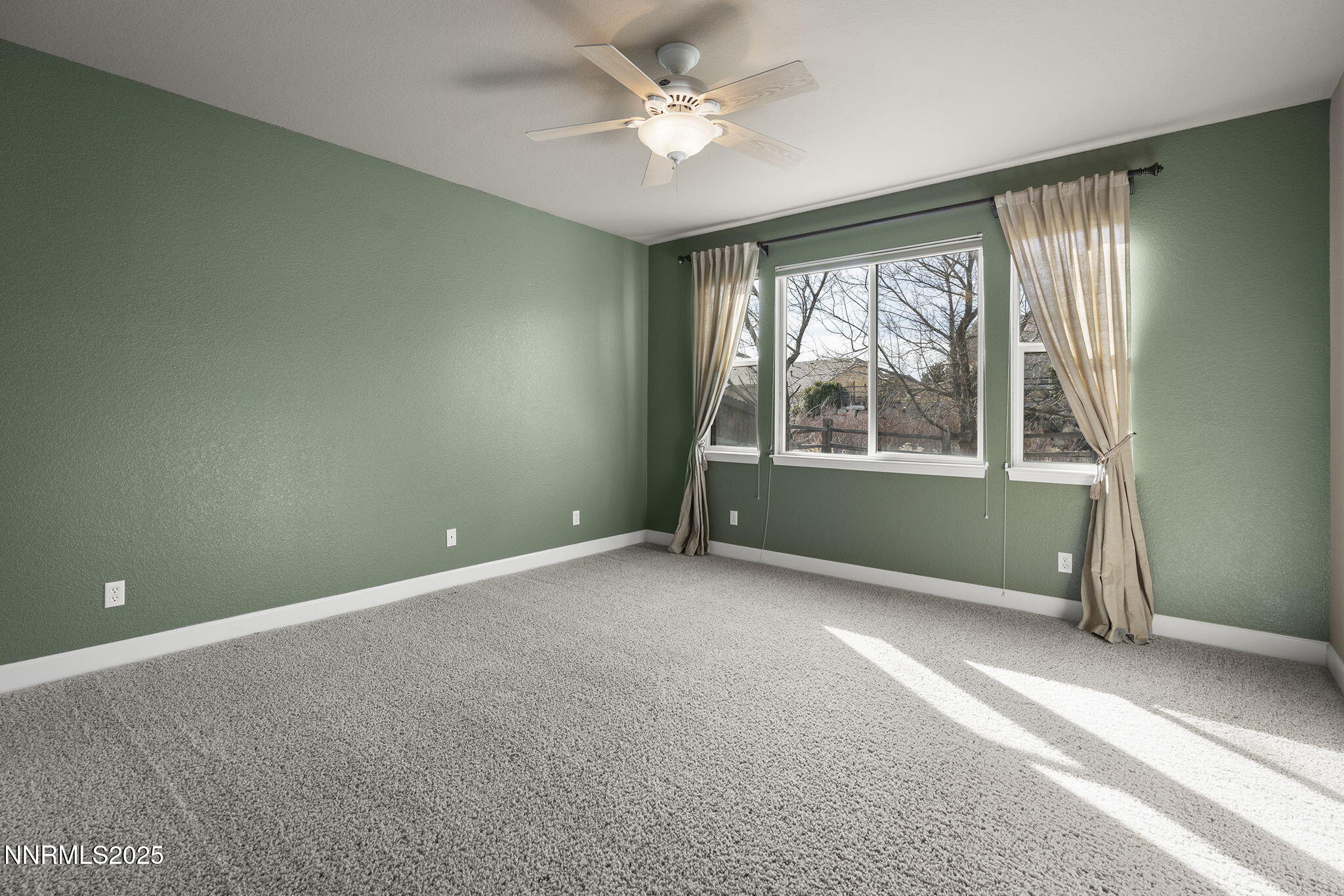 2757 Robb Drive Reno, NV 89523 - Photo 37 of 51 an empty room with a ceiling fan and windows