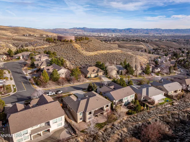 an aerial view of residential houses with outdoor space