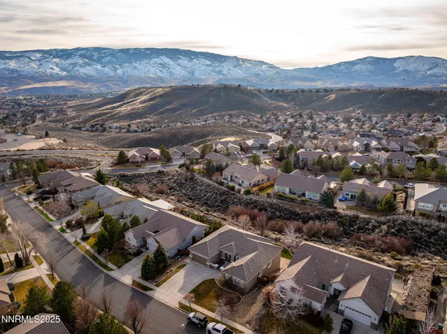 an aerial view of houses with outdoor space
