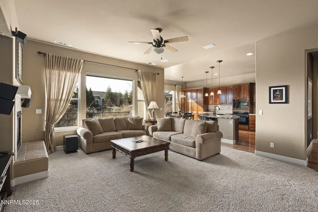 a living room with furniture and a large window