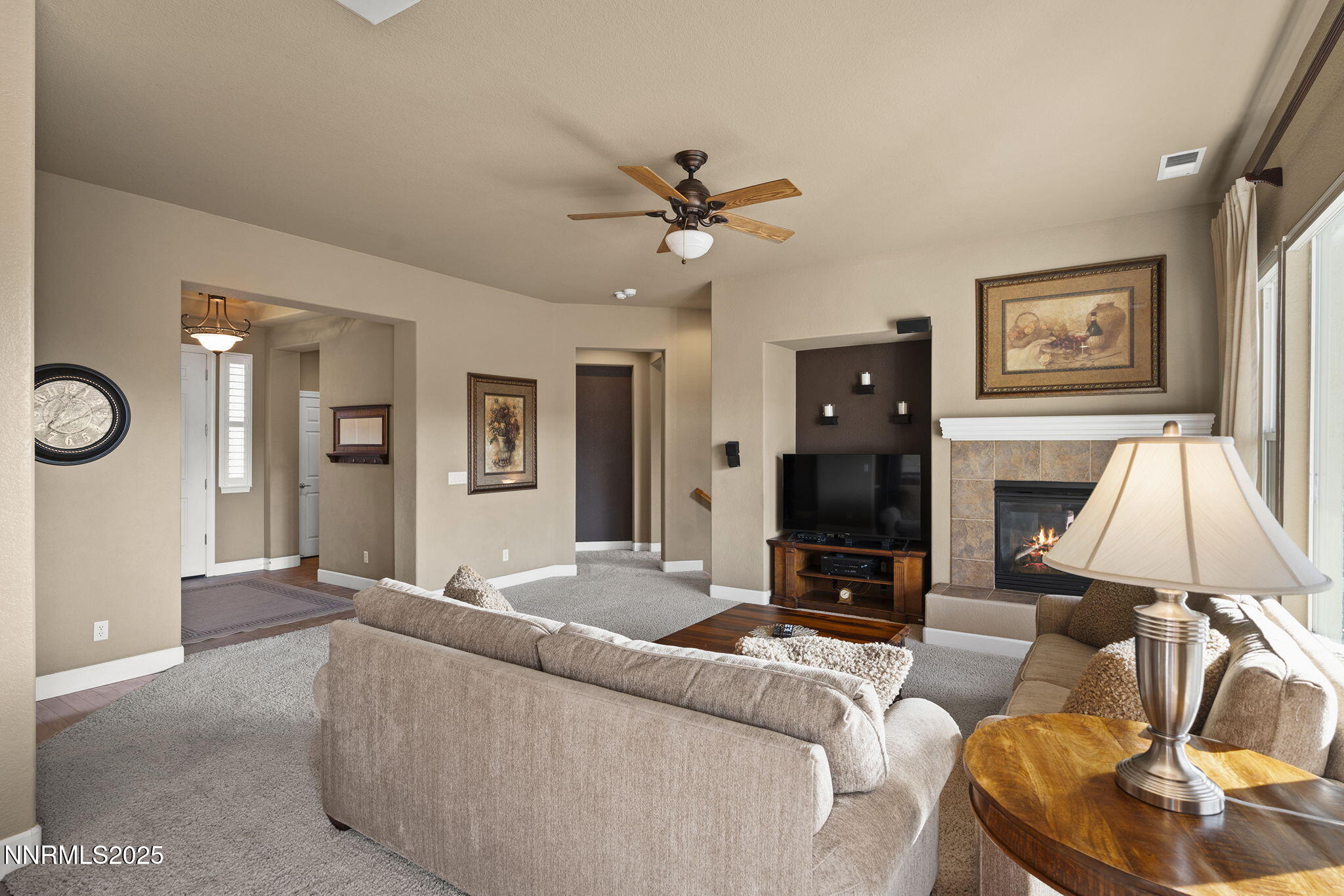 2757 Robb Drive Reno, NV 89523 - Photo 7 of 51 a living room with furniture and a fireplace