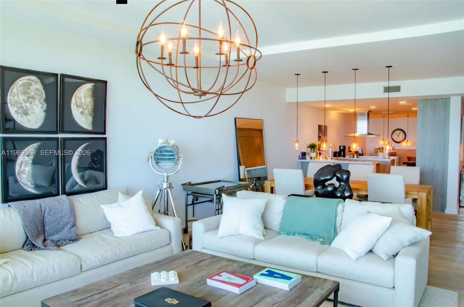 350 Ocean Drive, Unit 406N Key Biscayne, FL 33149 - Photo 18 of 41 a living room with furniture a fireplace and a chandelier