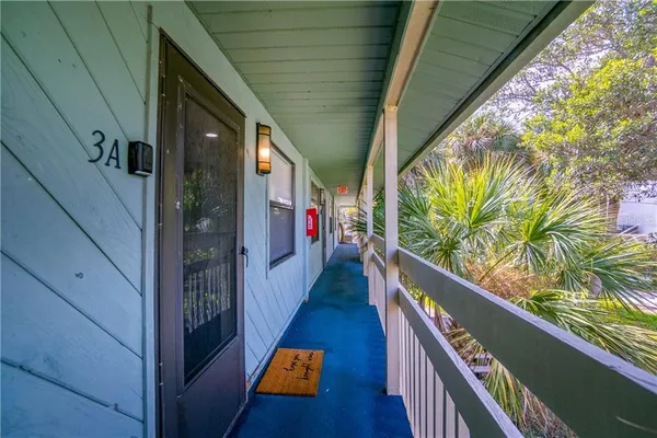 a balcony with wooden floor