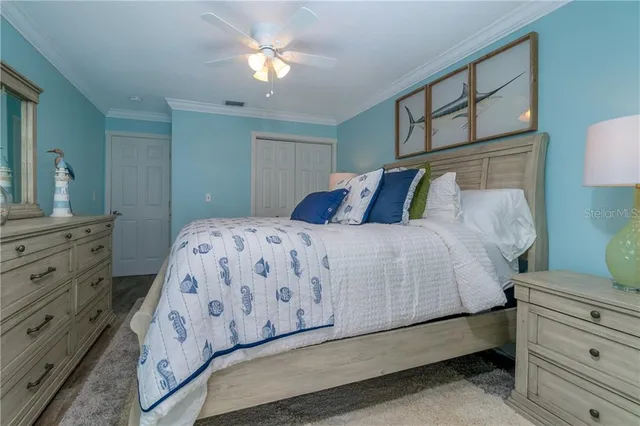 a bedroom with a bed and a dresser