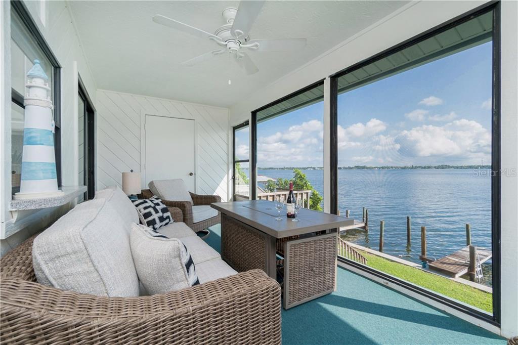 5041 North Beach Road, Unit 3A Englewood, FL 34223 - Photo 24 of 52 a living room with furniture and a large window