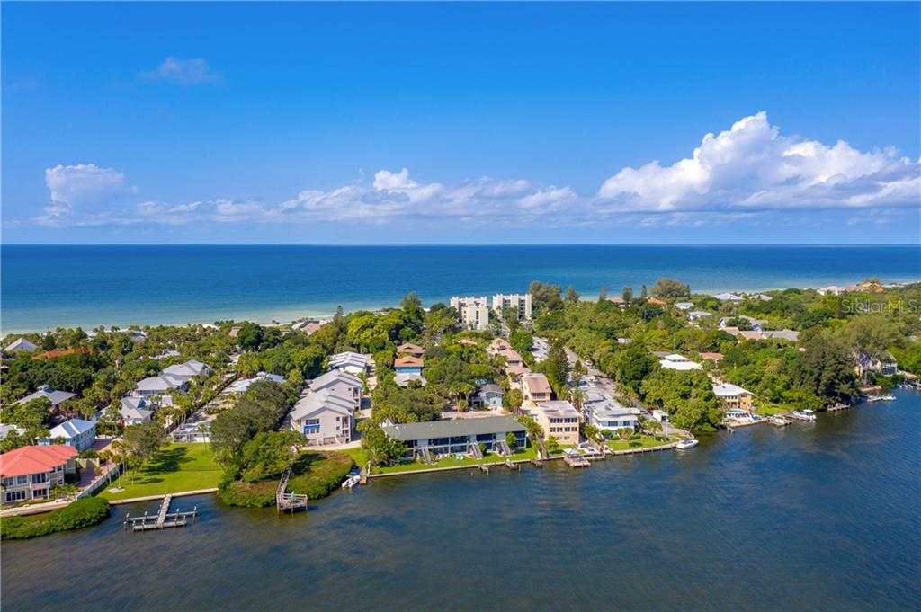 5041 North Beach Road, Unit 3A Englewood, FL 34223 - Photo 33 of 52 a view of a lake with a nearby beach
