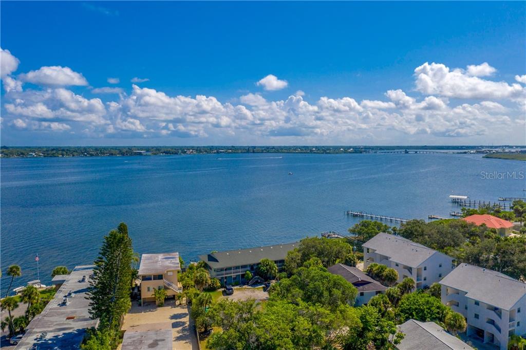 5041 North Beach Road, Unit 3A Englewood, FL 34223 - Photo 34 of 52 an aerial view of a house with a yard
