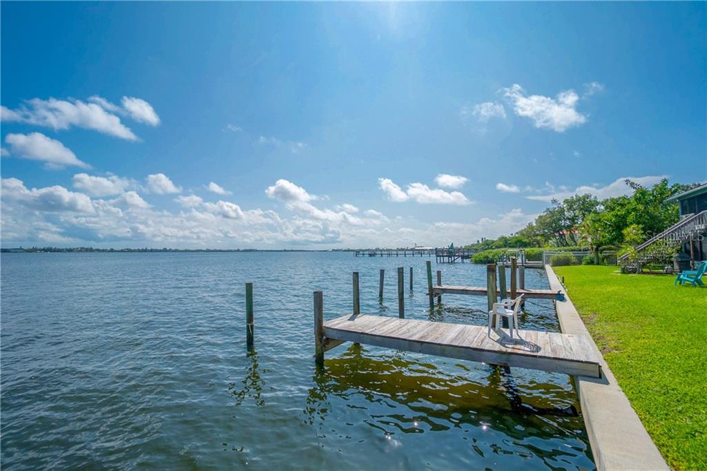 5041 North Beach Road, Unit 3A Englewood, FL 34223 - Photo 41 of 52 a view of a swimming pool with a patio