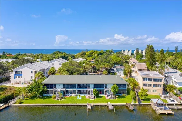 an aerial view of a house with swimming pool garden and patio