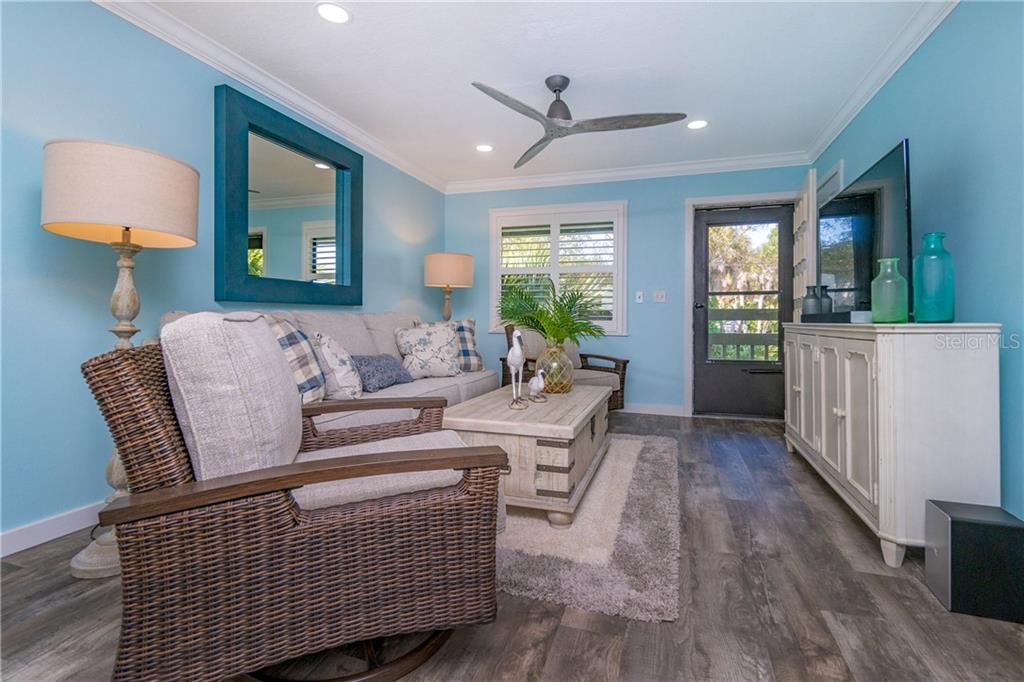 5041 North Beach Road, Unit 3A Englewood, FL 34223 - Photo 8 of 52 a living room with furniture and a window