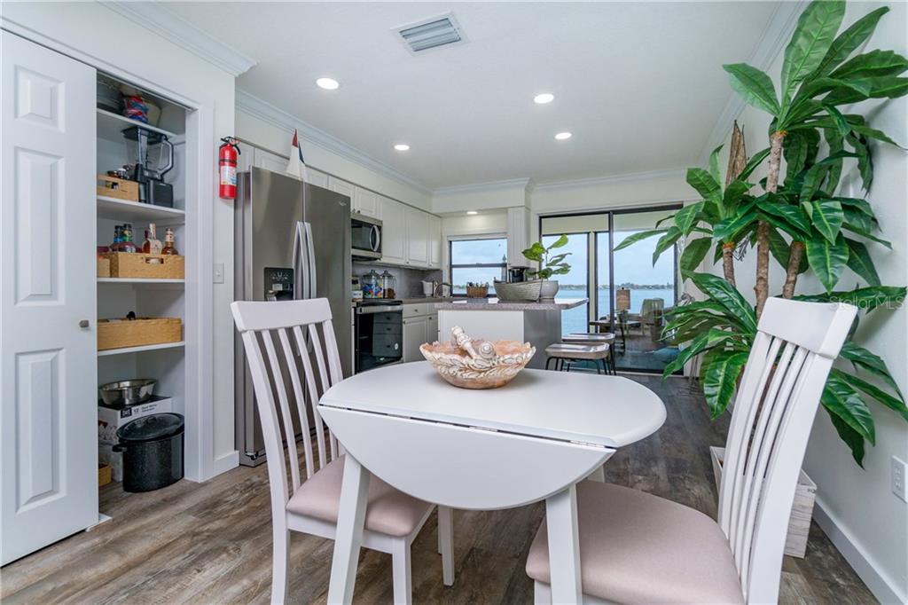 5041 North Beach Road, Unit 3A Englewood, FL 34223 - Photo 10 of 52 a view of a dining room with furniture