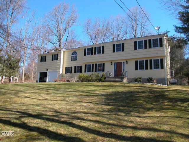 a front view of a house with a swimming pool