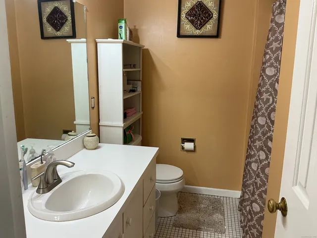 a bedroom with a bed and a table in it