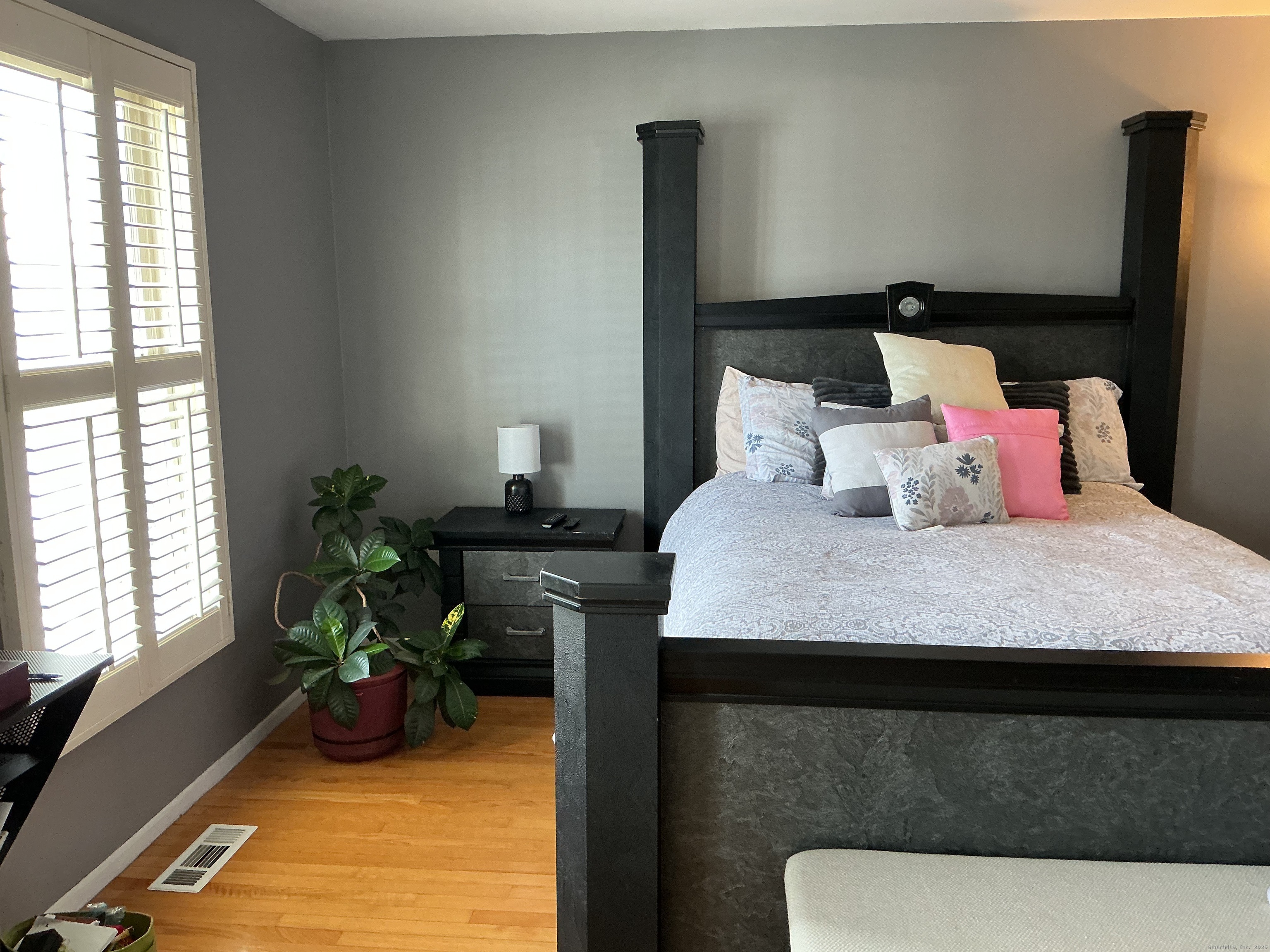 100 Front Street, Unit 100 New Haven, CT 06513 - Photo 12 of 17 a bedroom with a bed and a table in it