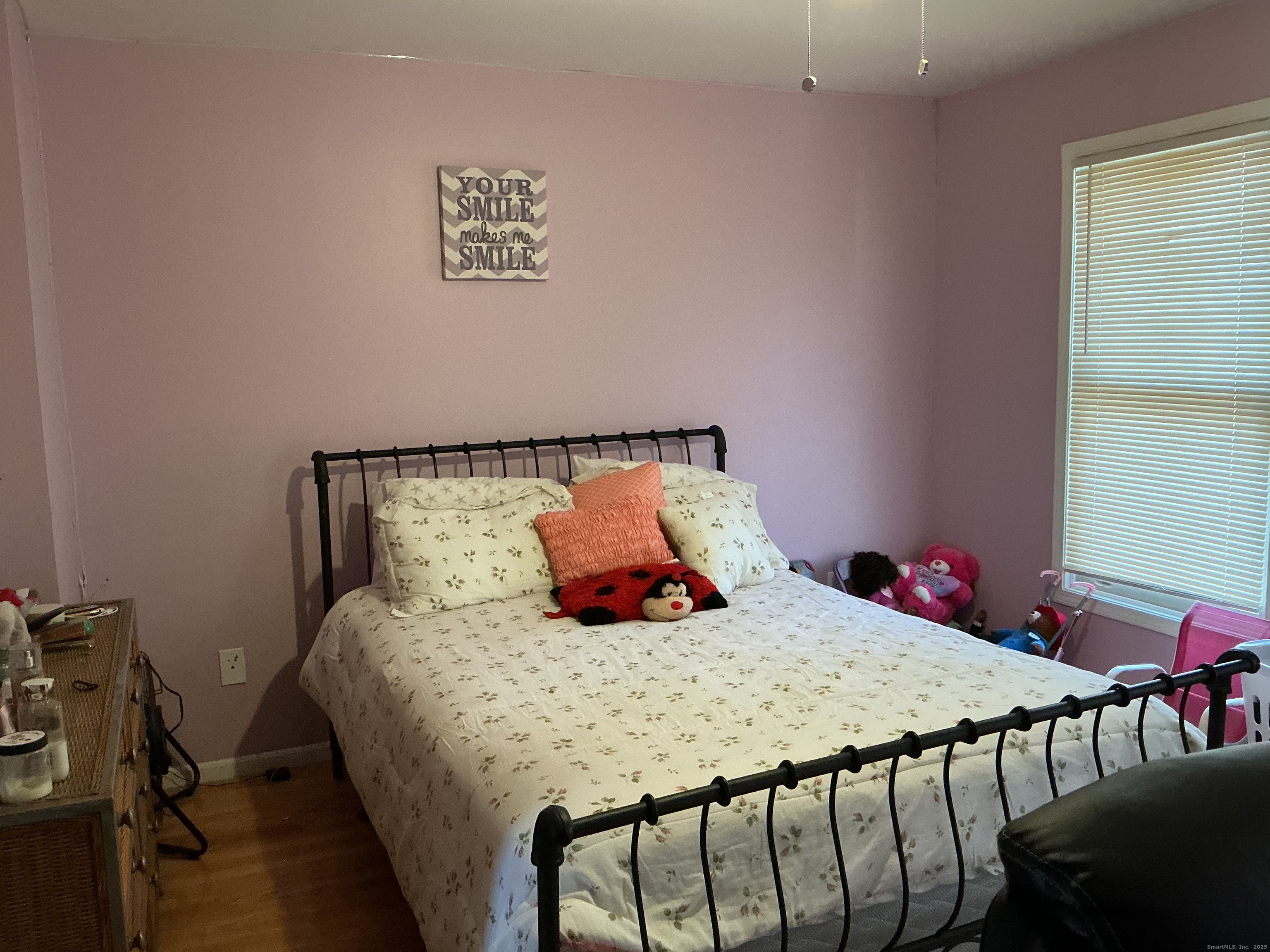 100 Front Street, Unit 100 New Haven, CT 06513 - Photo 15 of 17 a bedroom with a bed a table and chair