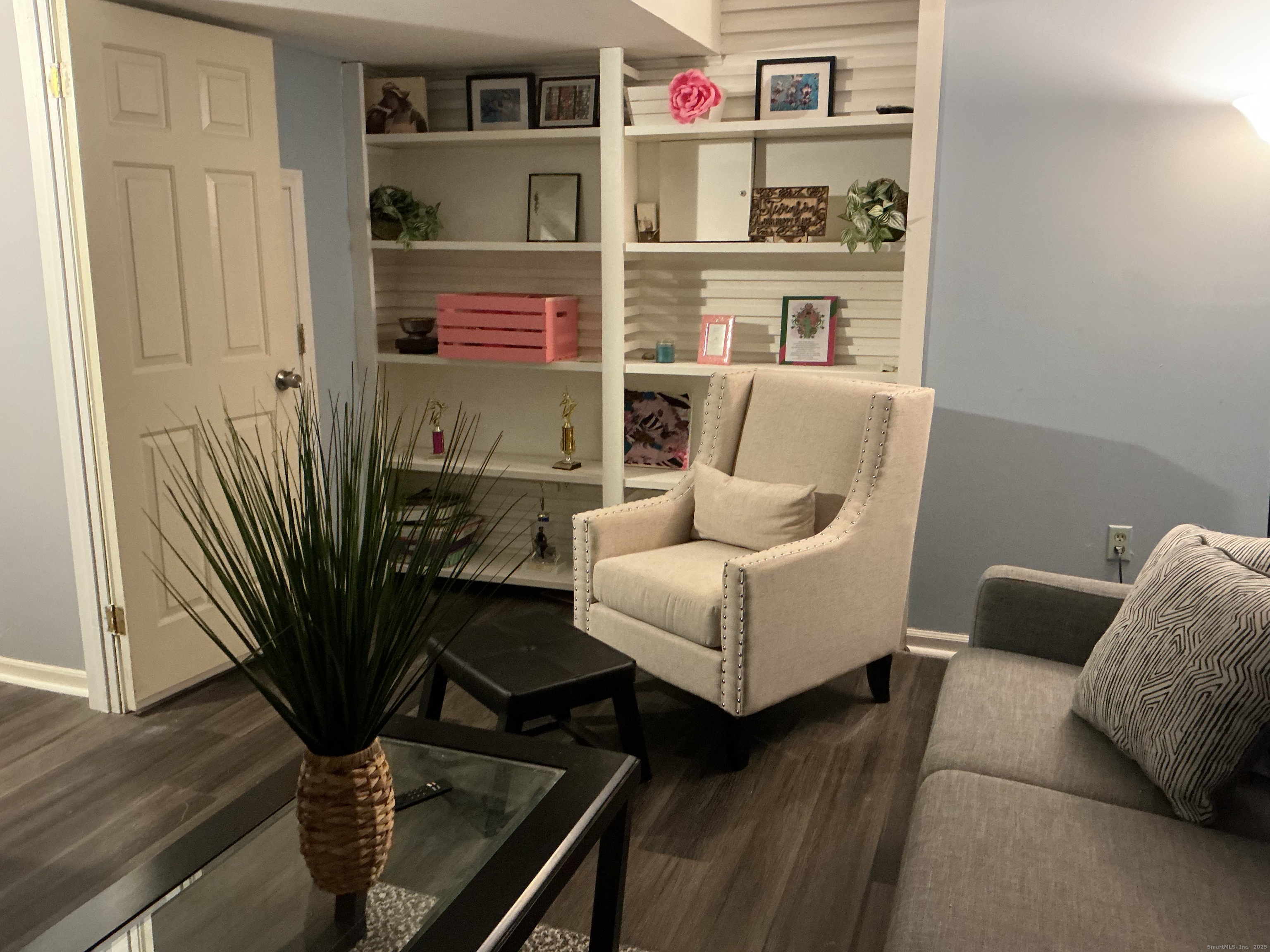 100 Front Street, Unit 100 New Haven, CT 06513 - Photo 16 of 17 a living room with furniture wooden floor and a potted plant