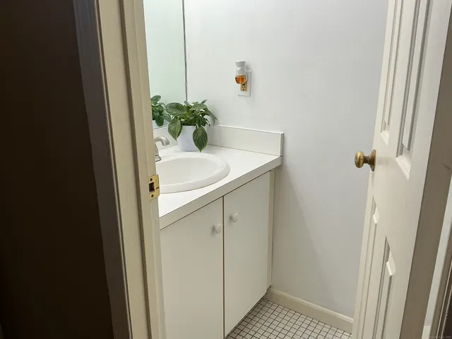 a bathroom with a sink and mirror