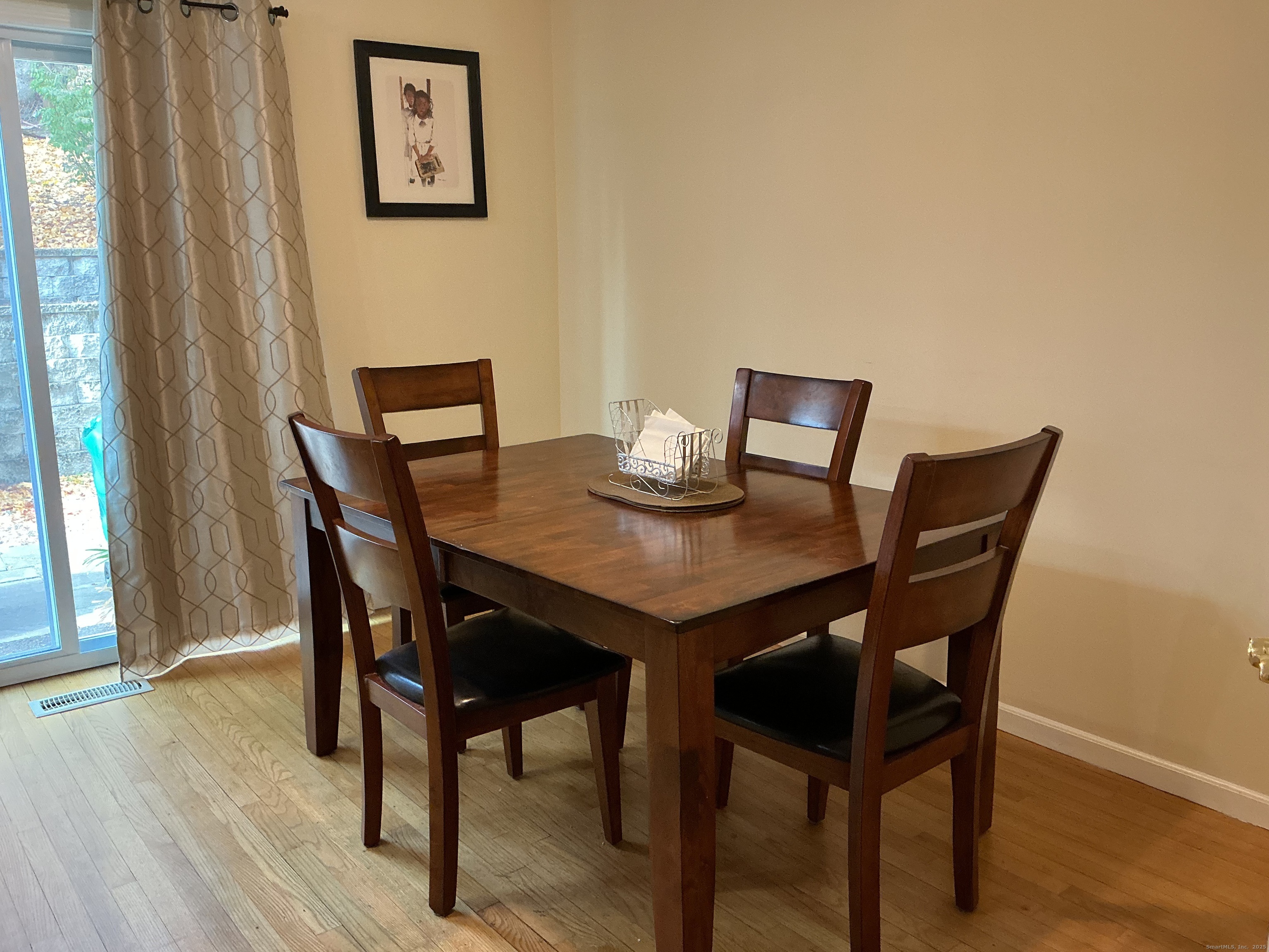 100 Front Street, Unit 100 New Haven, CT 06513 - Photo 8 of 17 a view of a dining room with furniture and wooden floor