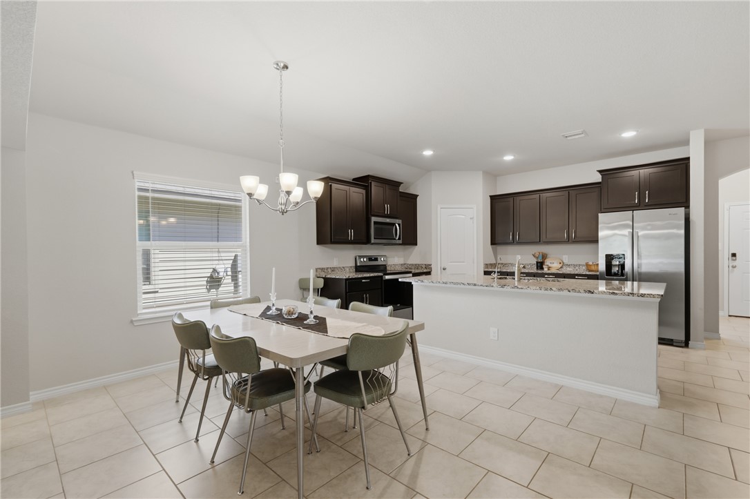 1943 Thorndyke Lane Bryan, TX 77807 - Photo 10 of 28 Kitchen and dining are connected so you never have to miss a conversation
