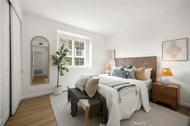 a bedroom with bed and a window